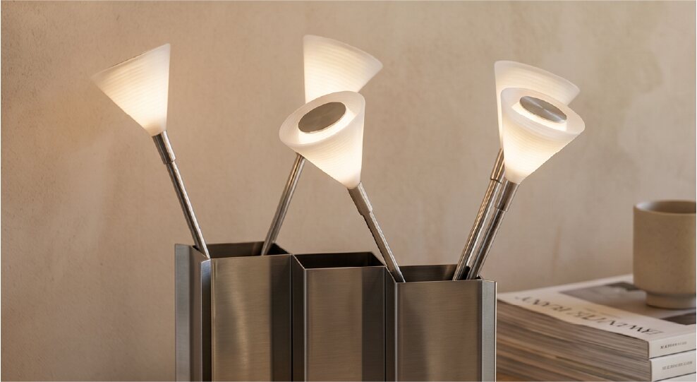 Three illuminated Laleh lights arranged in metal holders