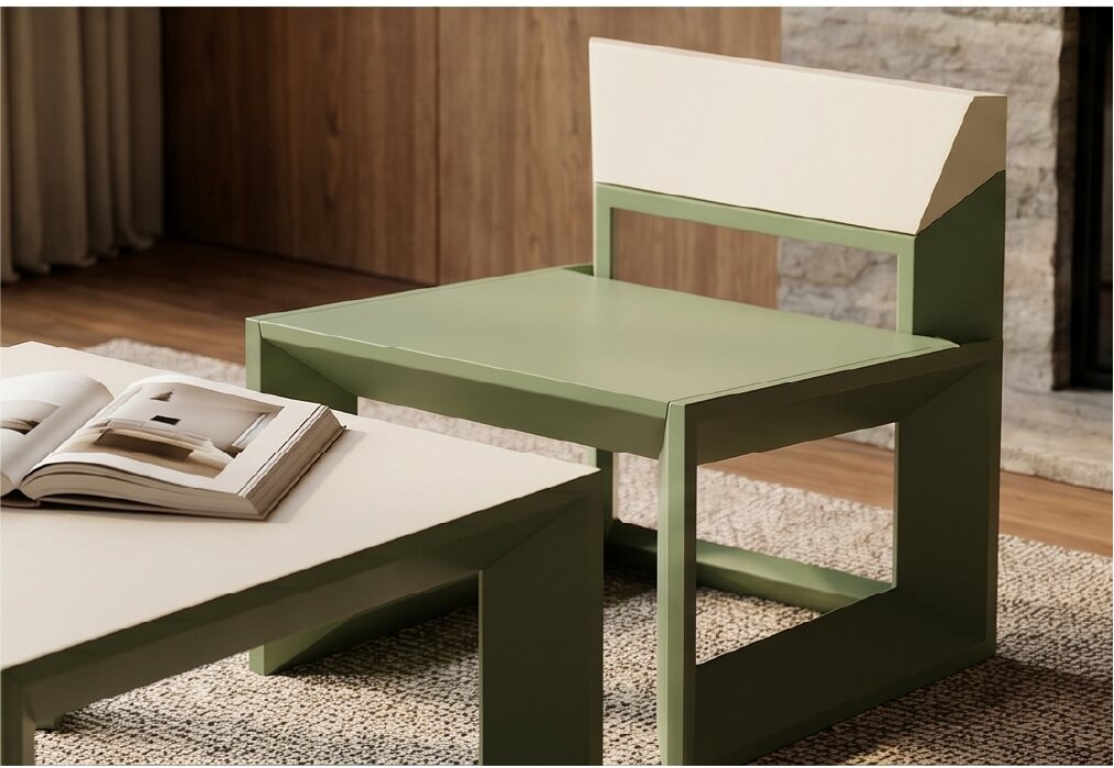 Green Rija Lounge Chair beside a table and open book
